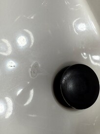 Dirty sink (and mirror) with toothpaste spit everywhere.