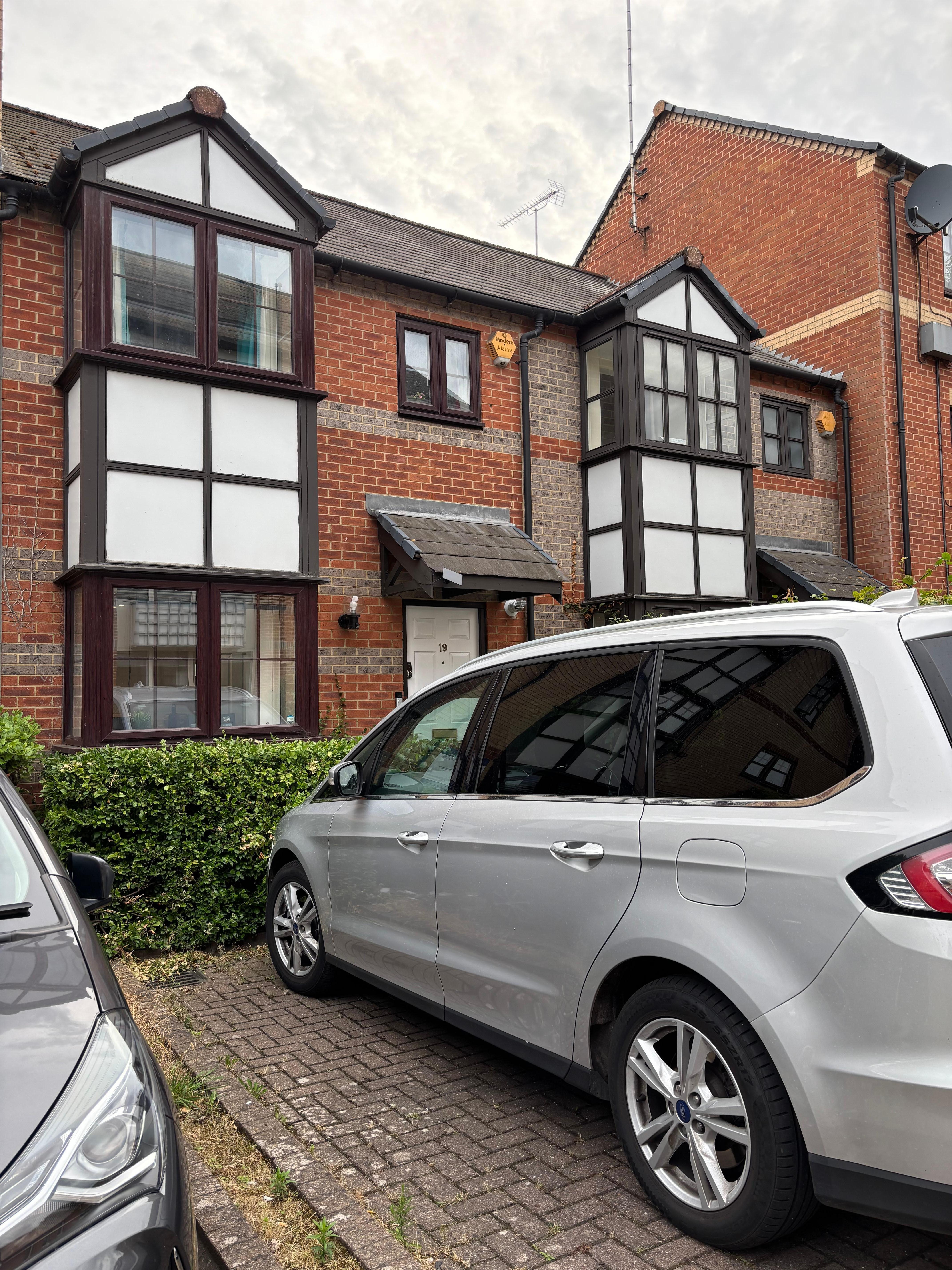 Front of house with parking