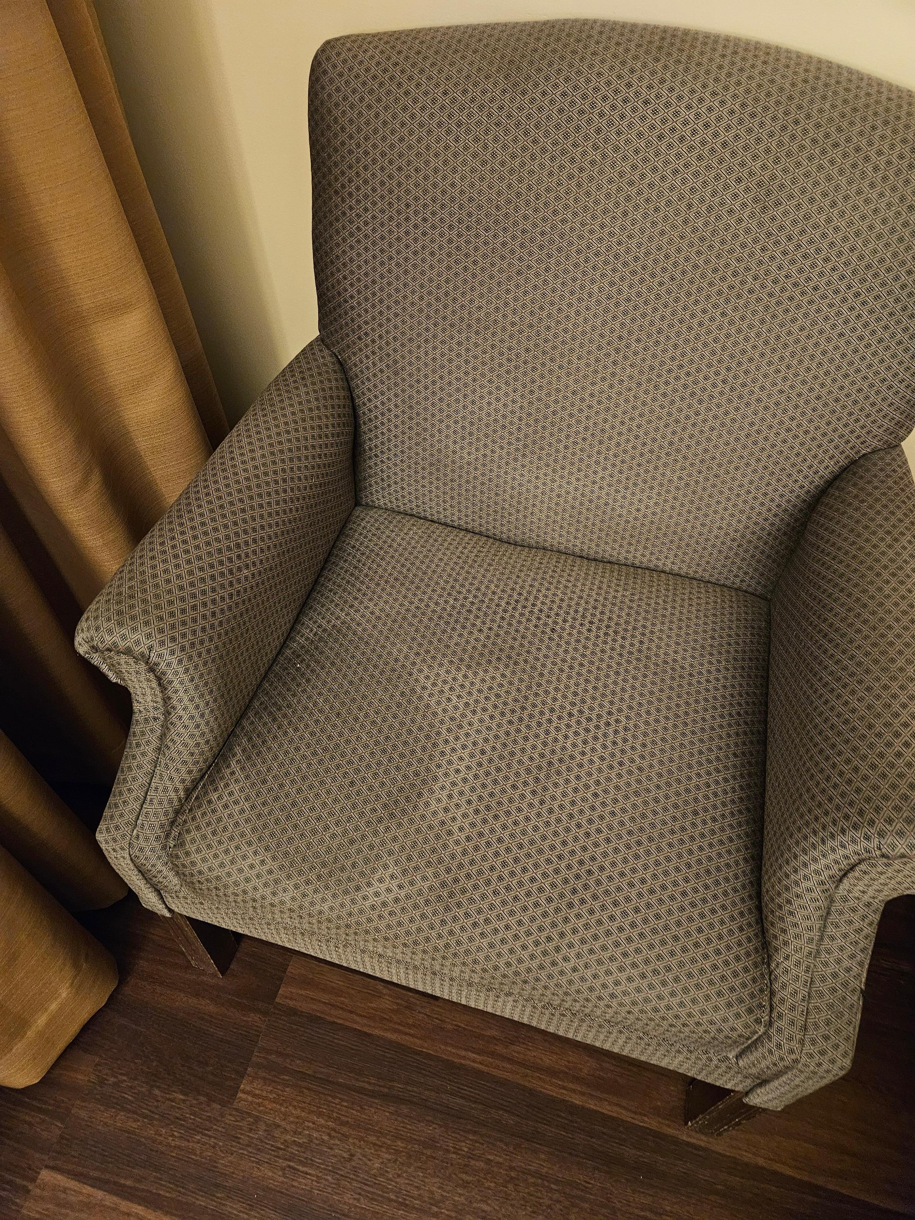 Only sitting chair in the room with alot of stains.