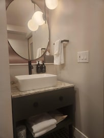 Small, but very nice bathroom. Plenty of towels plus a blow dryer.