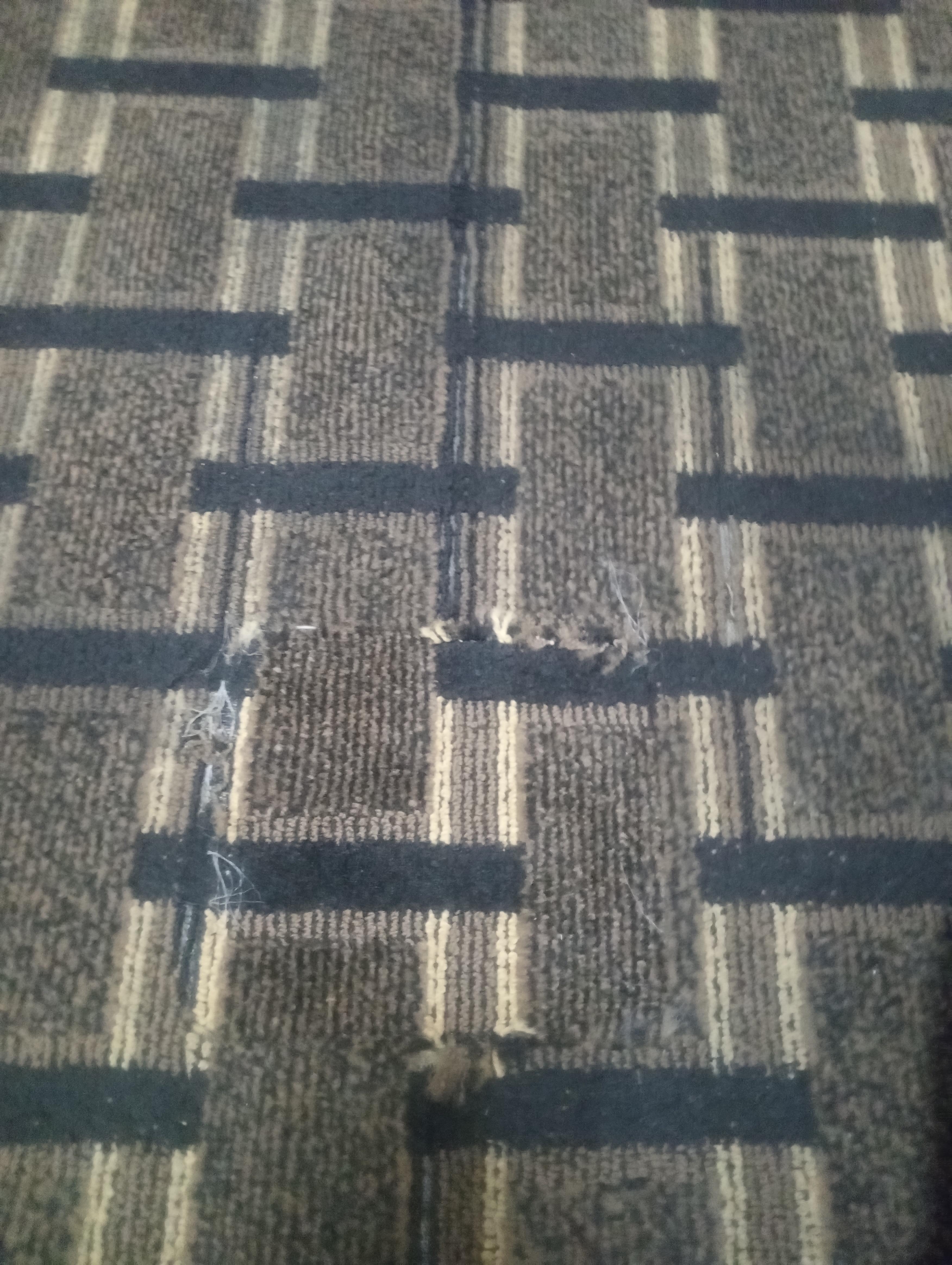 Torn carpeting 