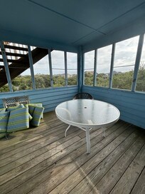 A table inside the deck with no chairs how are you supposed to use it?