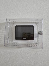 The thermostat in a locked box with no ability to change the temperature.