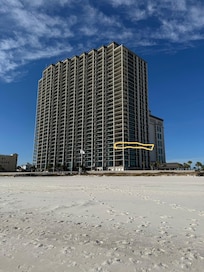 View of building from beach. Condo is highlighted.