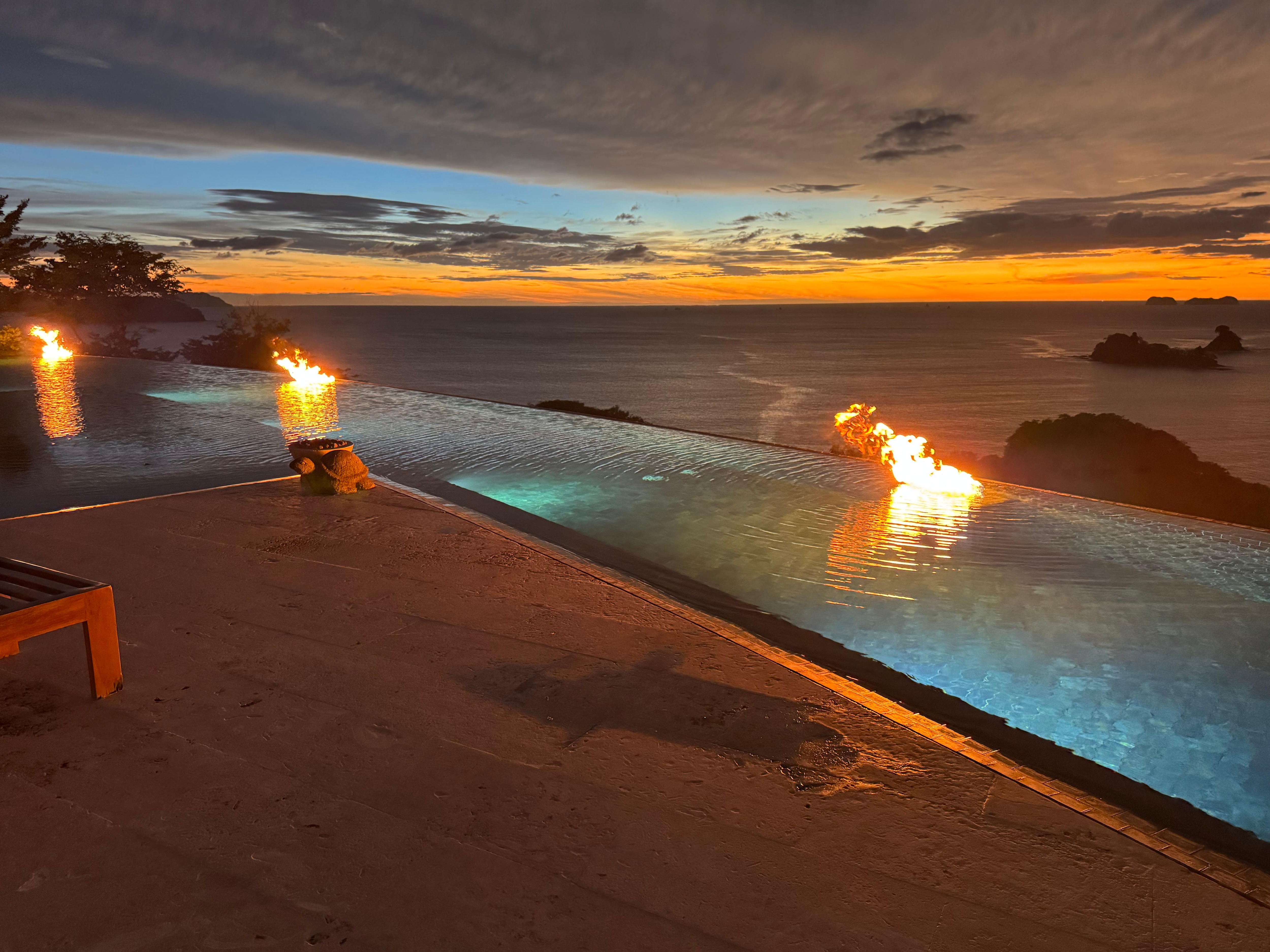 Infinity pool fires at sunset