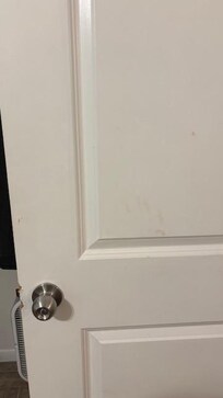 Door to twin bedroom - blood spot and blood handprint - I cleaned off myself with clorox wipes