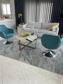 Beautiful and Comfotable living room with huge tv