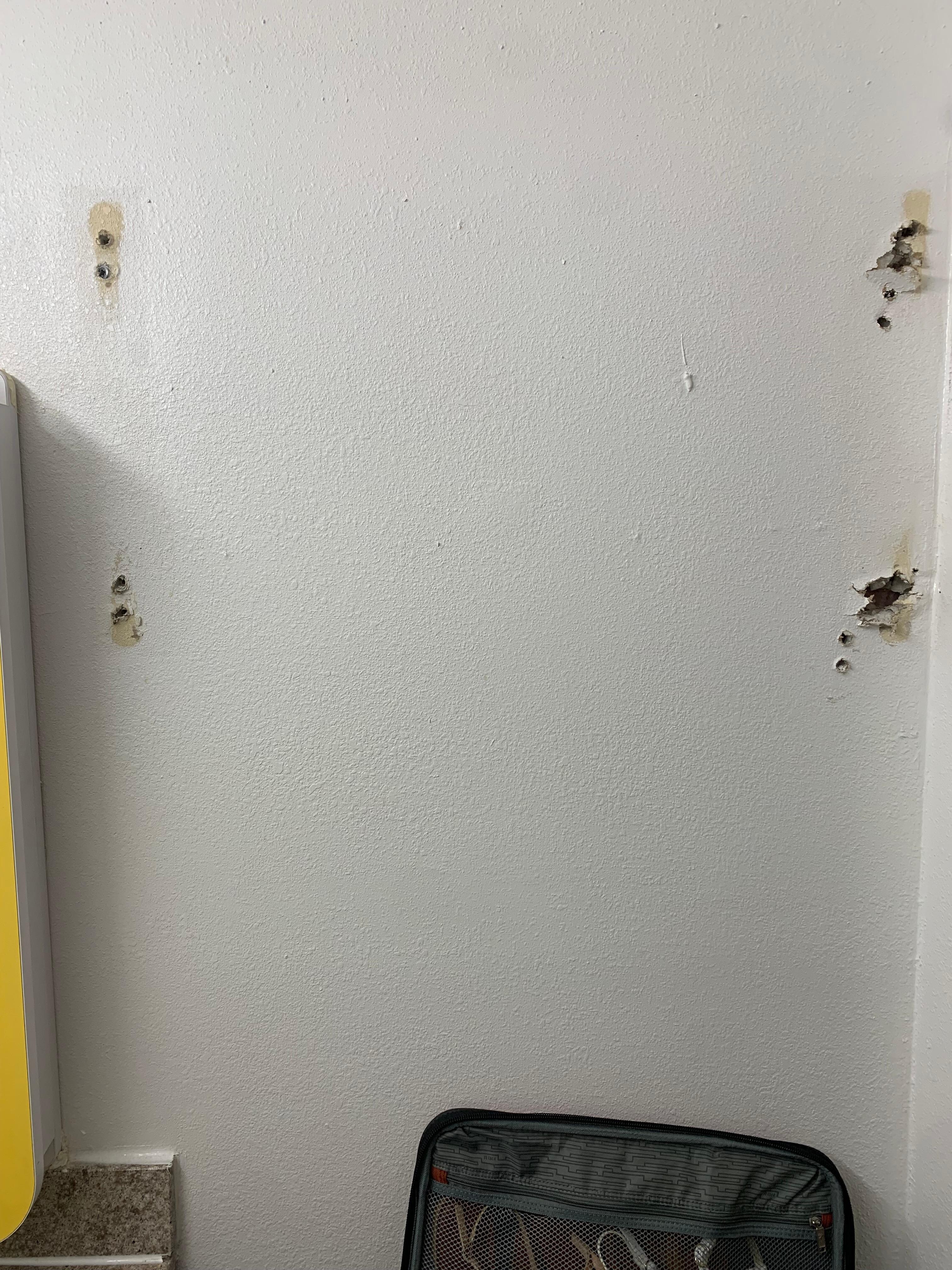 Holes in wall where something missing