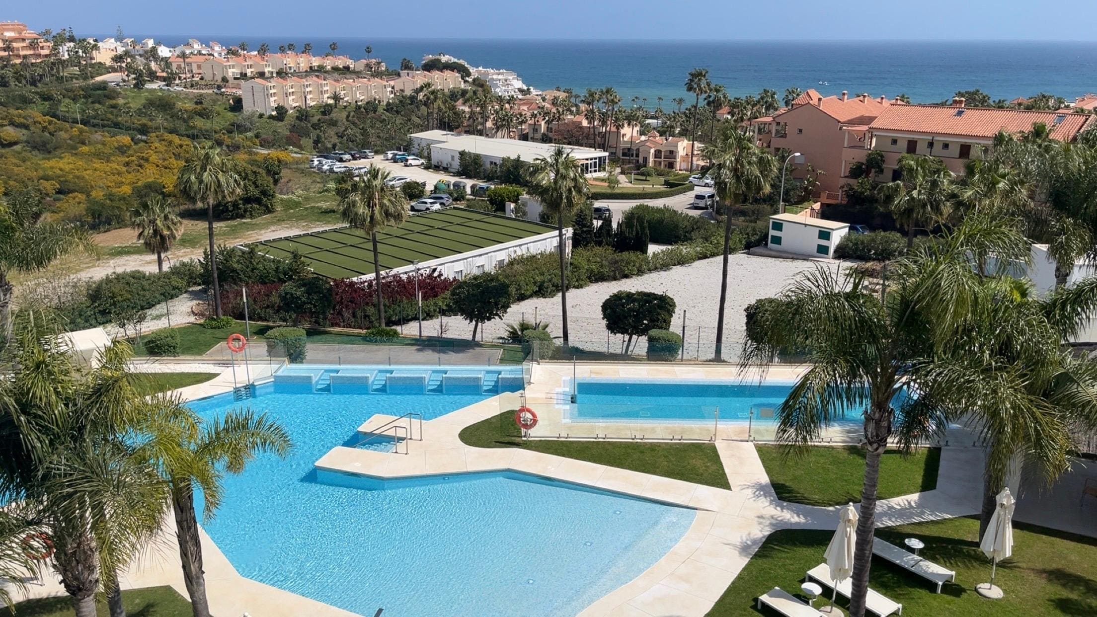 The small pool to the right is heated in late March. All other pools, including the one on your unit's terrace, are not.