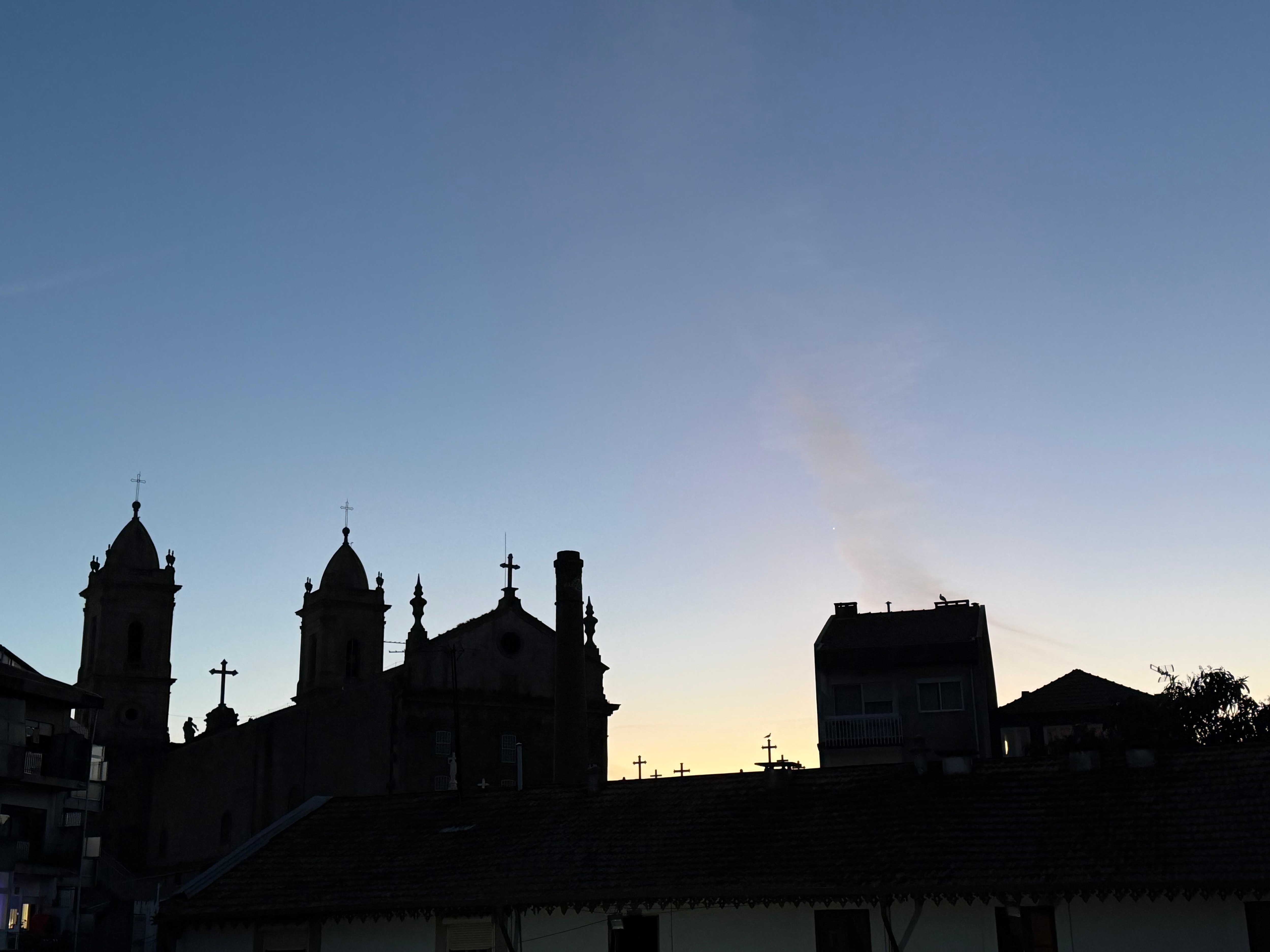 Beautiful sunset silhouettes from the cemetery and church of Lapa on the backside of the block, from the main bedroom