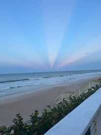 Kaleidoscope sunbeams cast through the clouds from the beautiful sunset