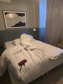 NOT a king-size bed. Barely a queen. Mattress on top is smaller than frame.