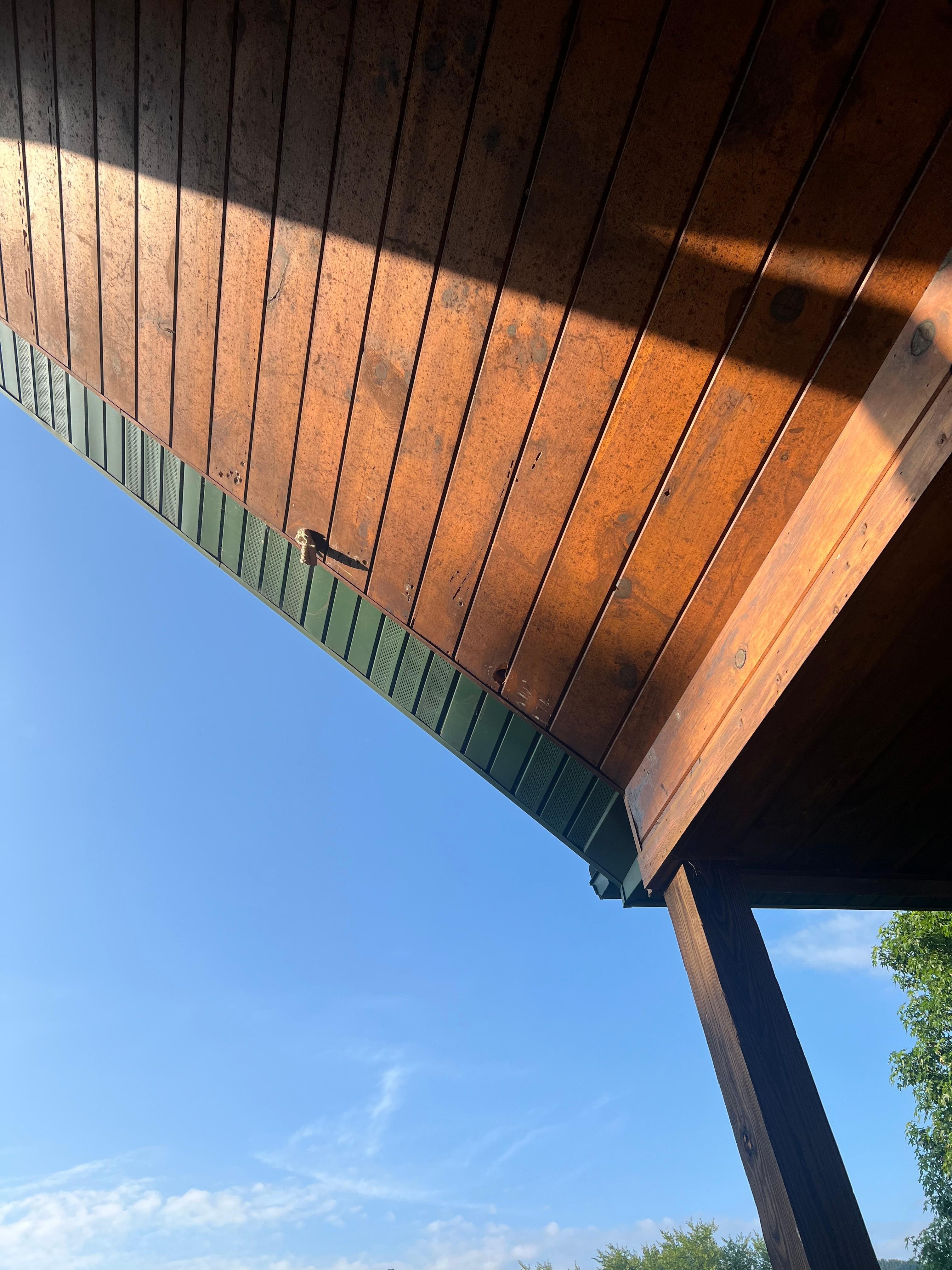 Holes in the roof of porch stuff with what appears wash cloths