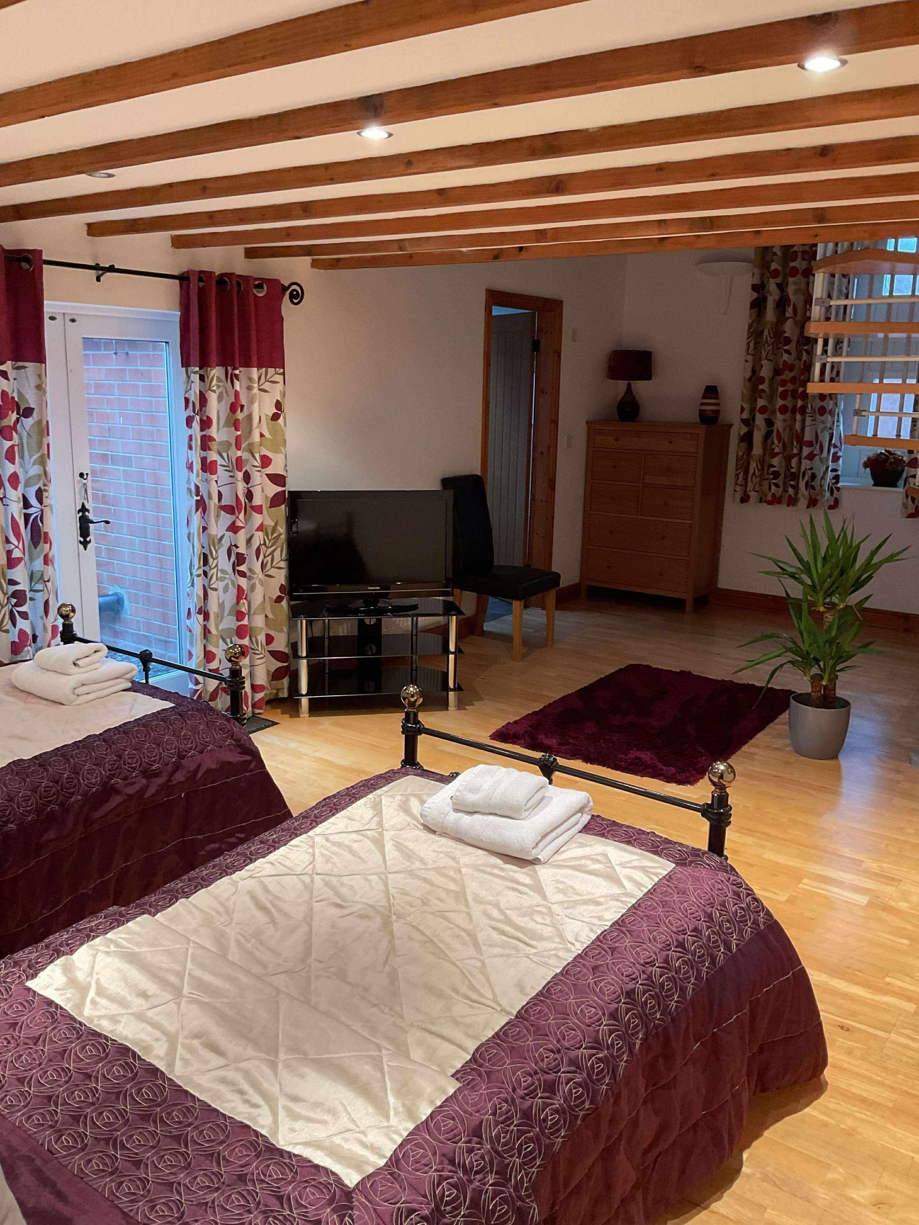 Twin beds on ground floor with a bathroom off from the room