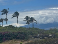 Still looking out the back view to the left. Path to the closest beach and there is a shop on the beach to rent beach and snorkeling equipment.