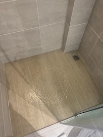Slow draining shower