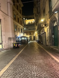Hotel entrance at the end of street on the left