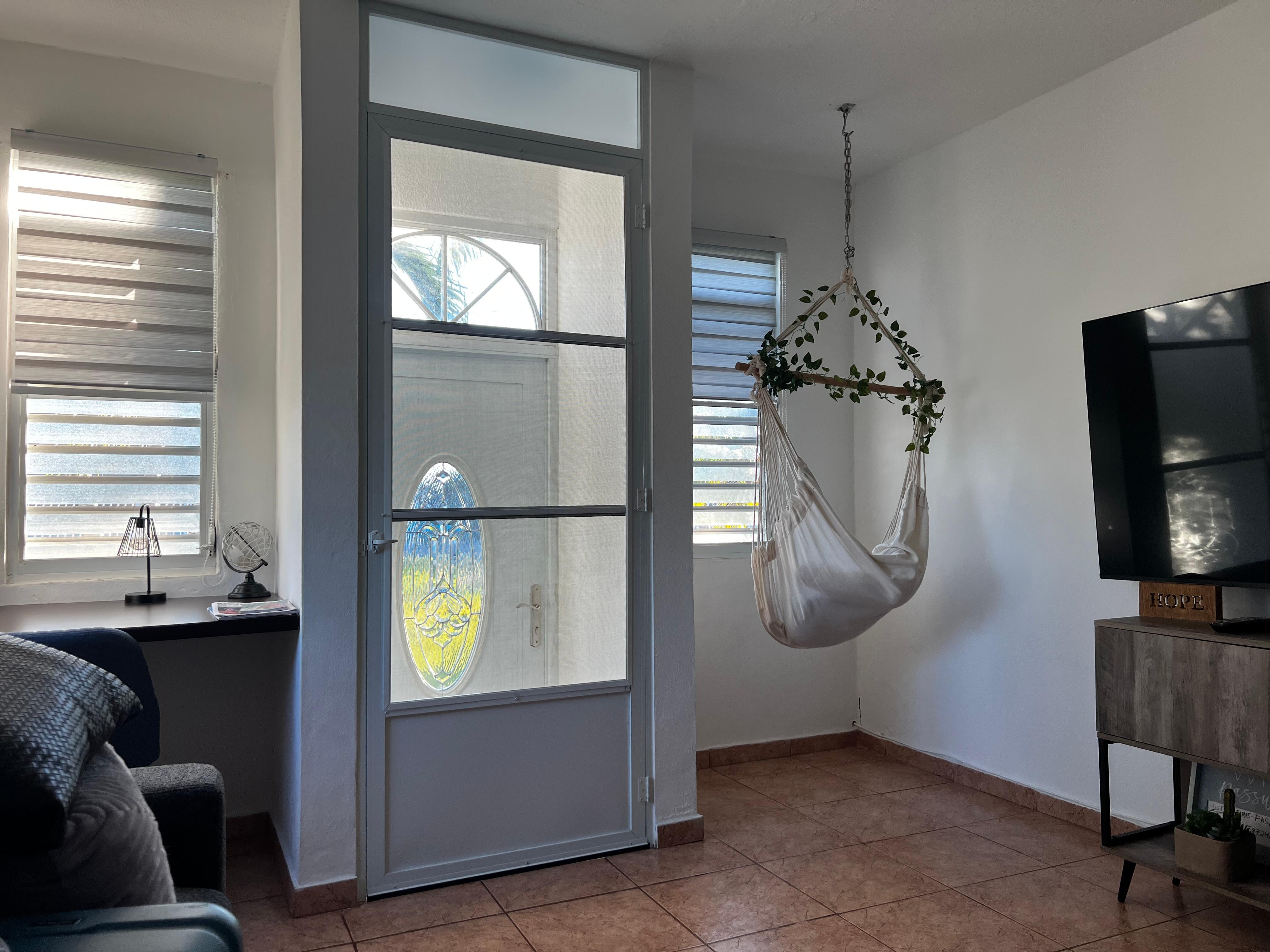Living space with desk and tv