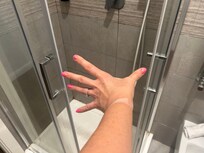 Distance shower screen opens to fit through