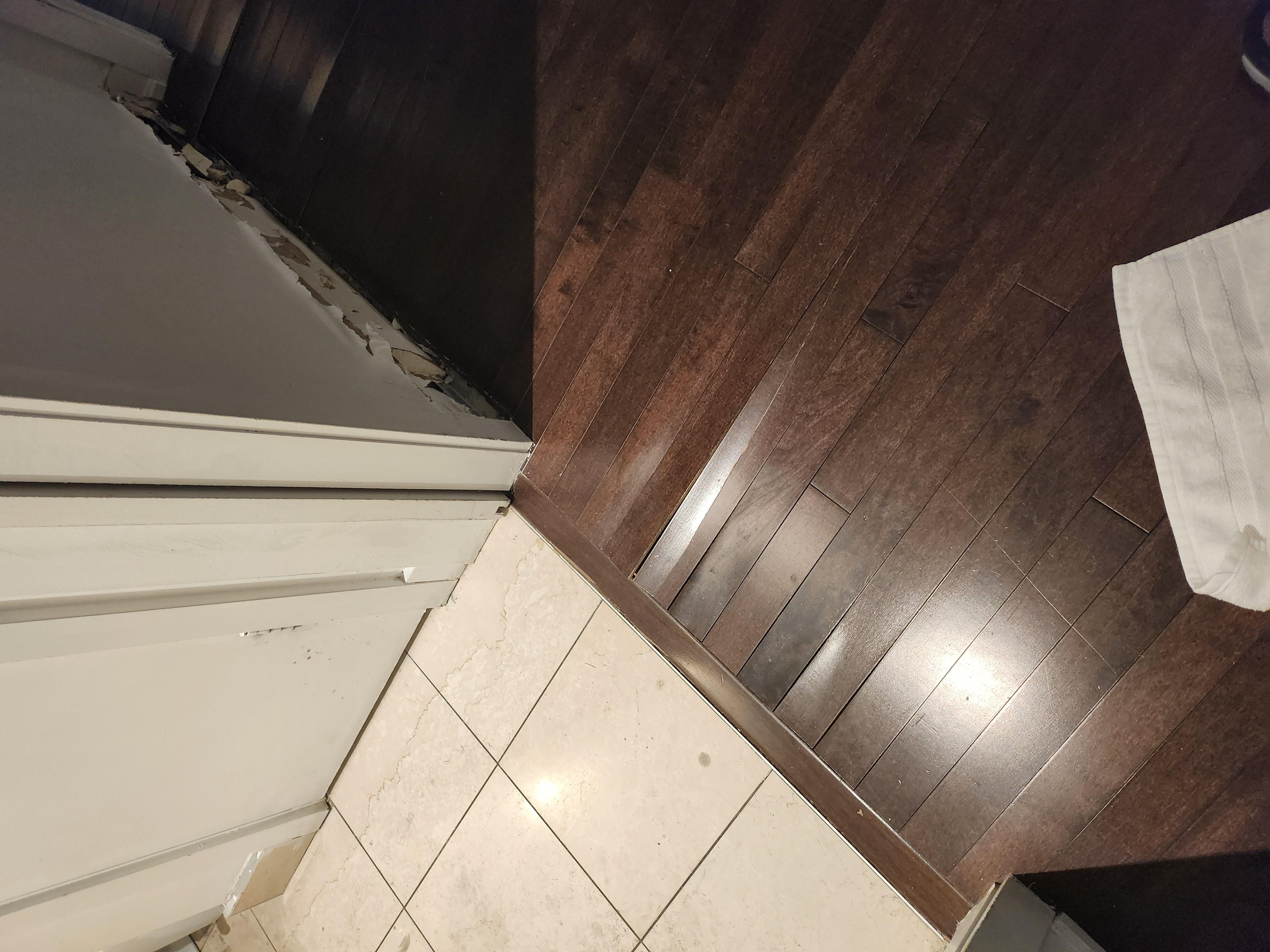 Laminate flooring lifted ( trip hazard ) base board missing
