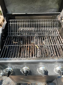 Dirty grill with multiple EMPTY propane tanks