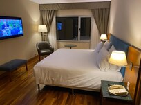 Large bedroom but with dated décor and only one power socket on the other side of the room