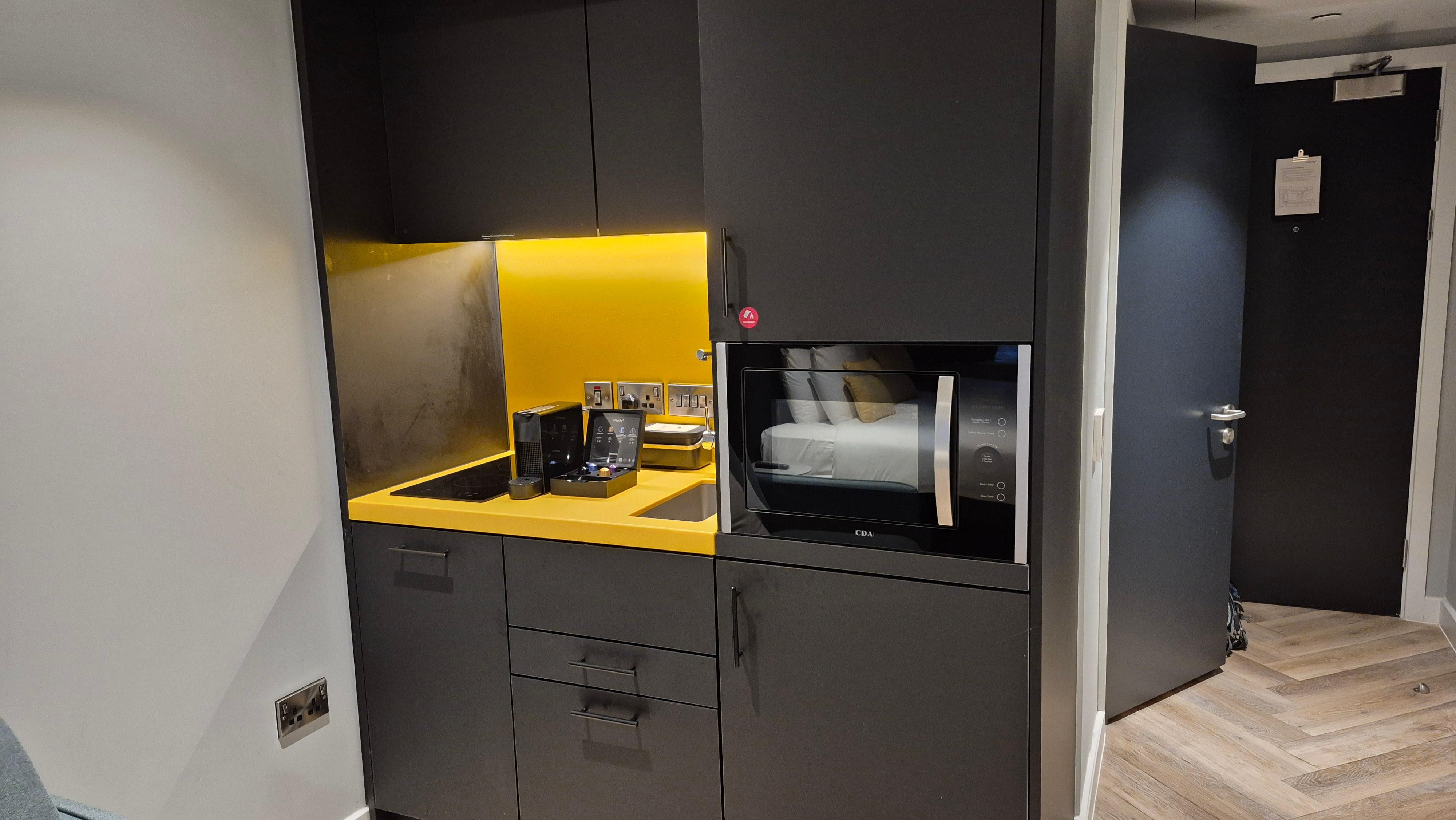 Tidy, cute and functional kitchenette.