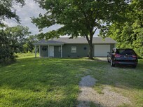 View of the house and parking.