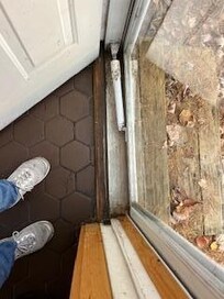 Door entrance with mold and mildew and rotted wood