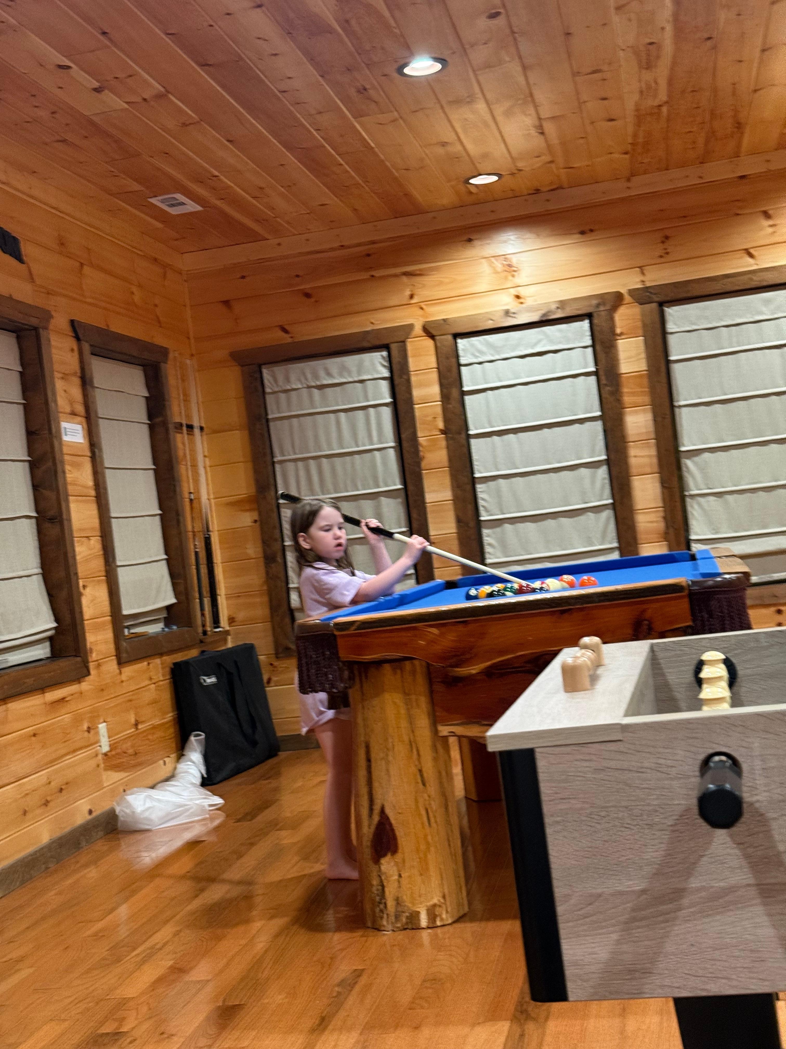 My little one shooting some pool. 