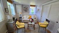 Sittting room with fold out couch. This was at the end of our stay. When we arrived, the pillows were perfectly arranged. Fresh flowers from the garden were such a lovely touch!