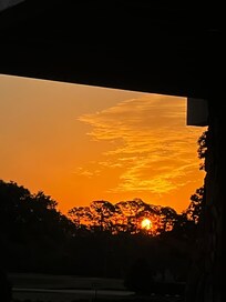 Sunrise over golf course taken from front porch by our room.