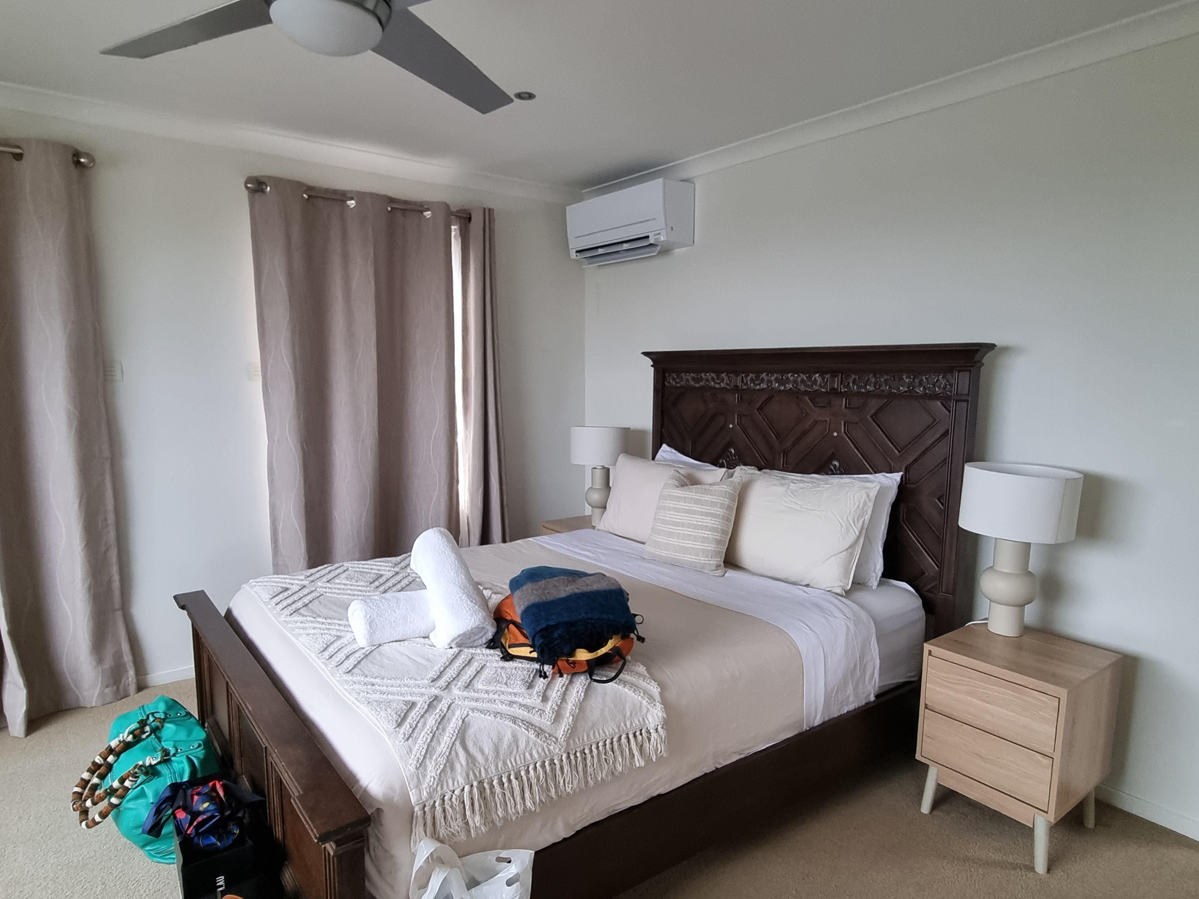 Master bedroom has panoramic window view of the bay. Especially beautiful at night with Melbourne skyline lit up.