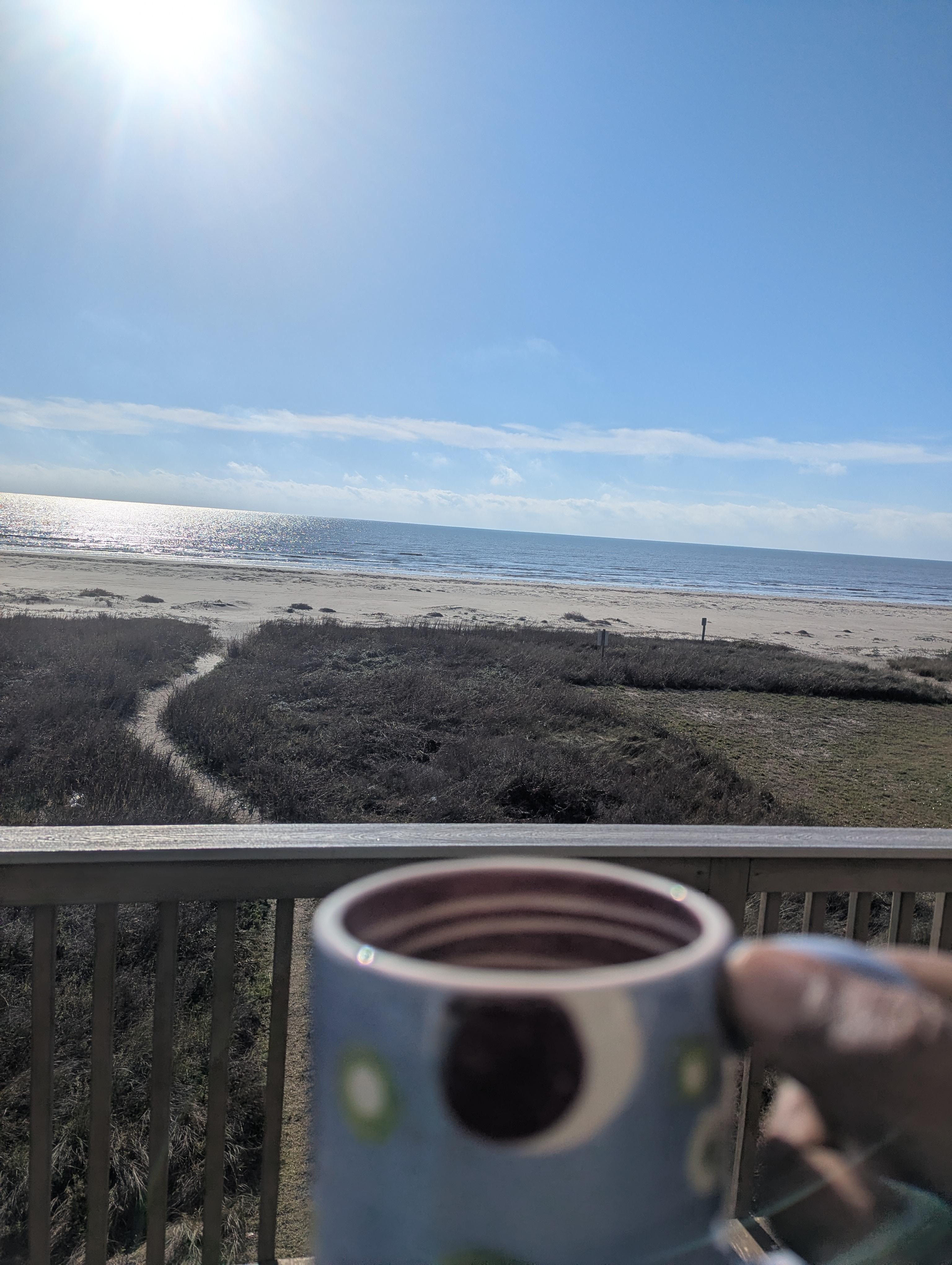 Enjoying the view with a cup of Joe.