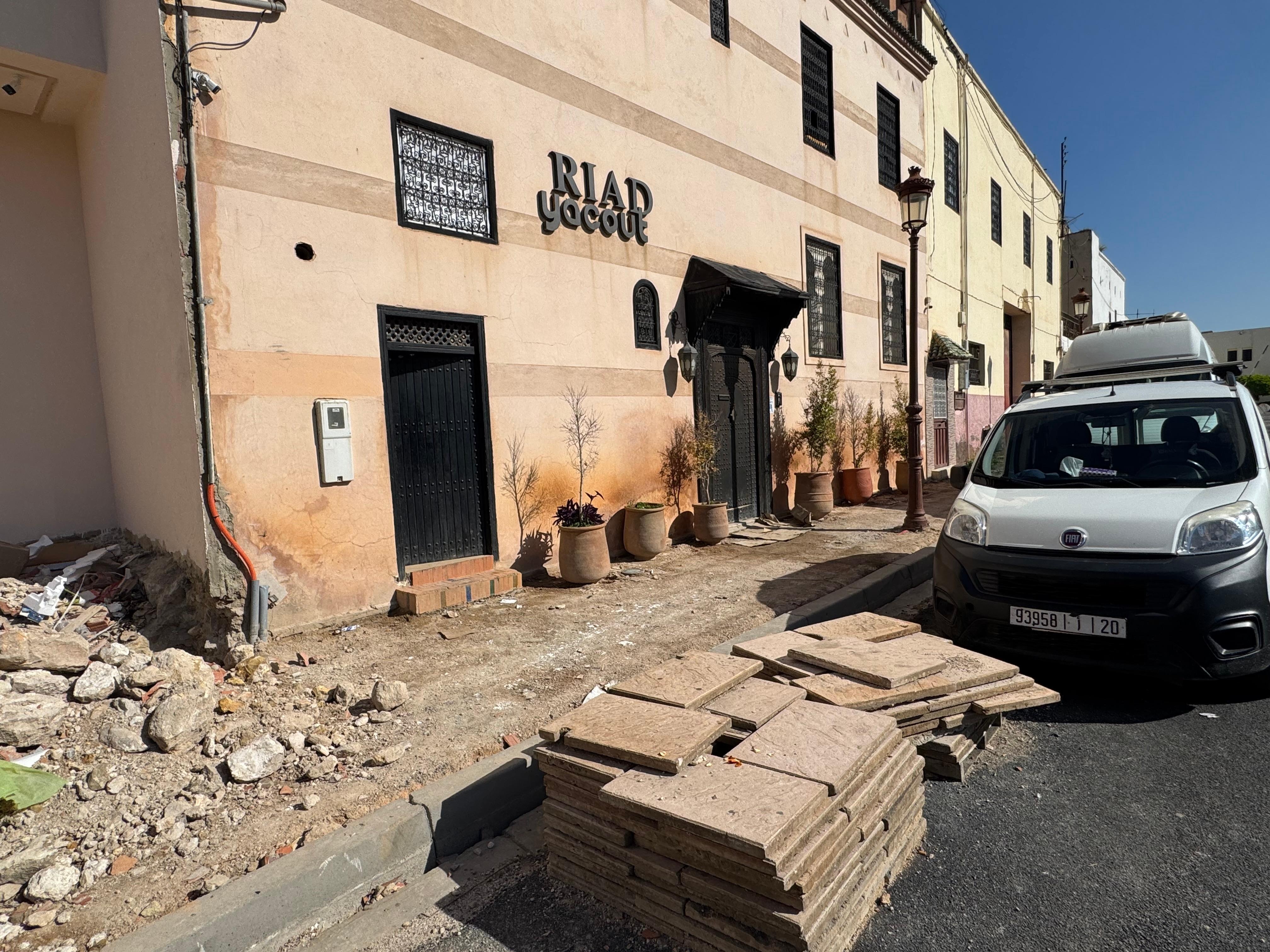 You have to step on flattened cardboard boxes to enter the premises