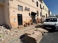 You have to step on flattened cardboard boxes to enter the premises