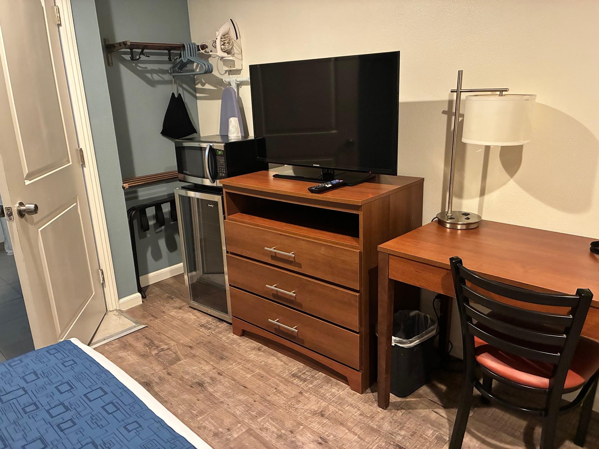 Wine cooler, microwave, tv and desk