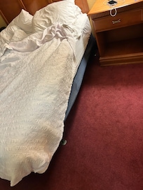 Box spring is broken, you can see it in the wrinkled blue material. It was awful.