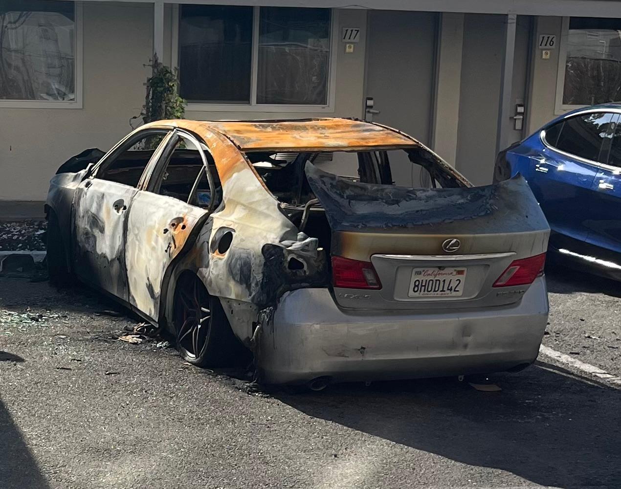 Burned out Lexus about 60 feet from the office.