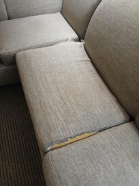 Sofa cushion torn. Sofa stained
