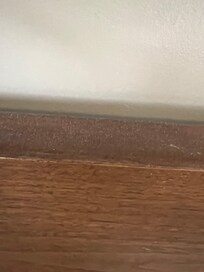 Dust on top of bed frame that I asked be wiped clean.