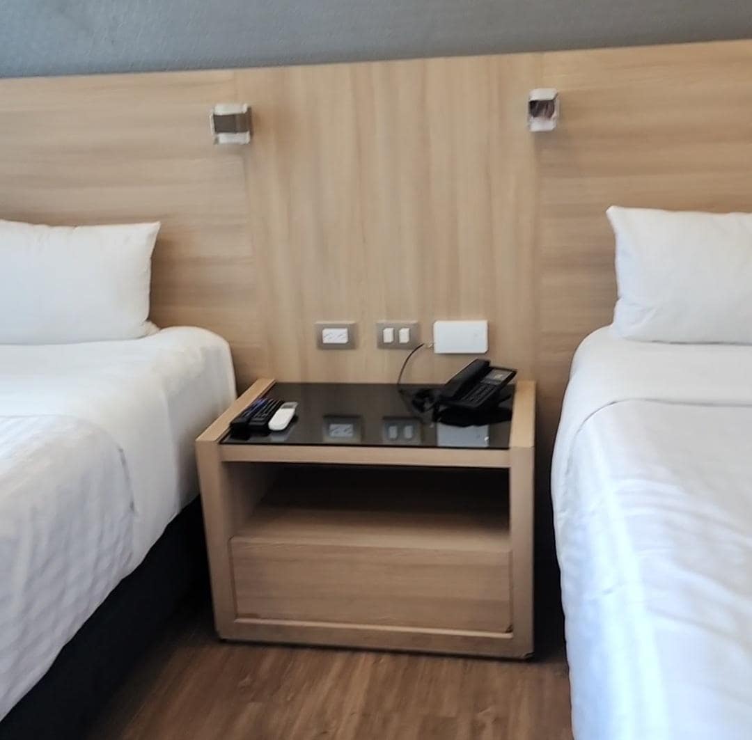 You can choose between one or two beds, with a nightstand in the center featuring power outlets and remote controls for the mini-split and TV.