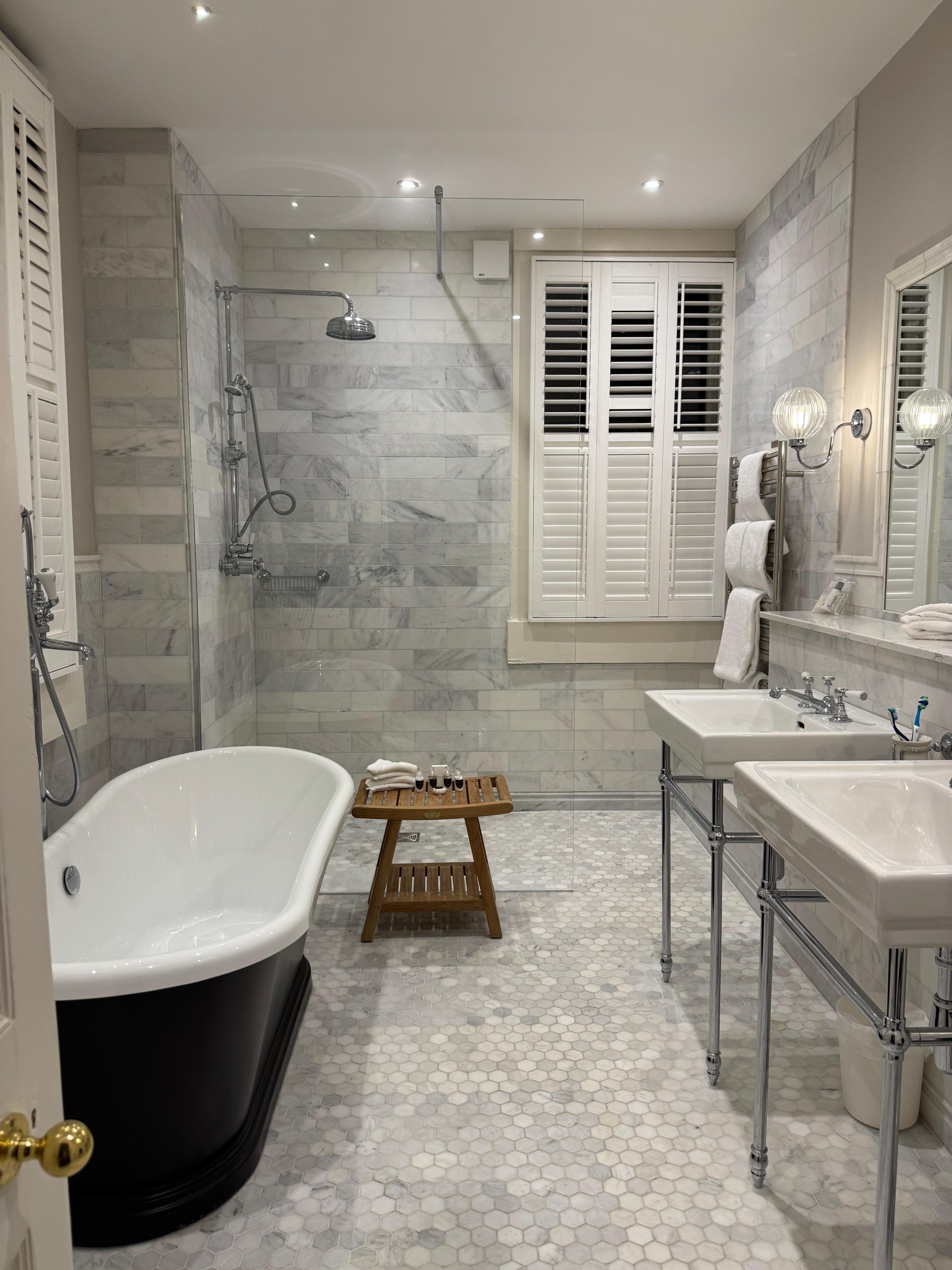 Spacious bathroom with separate shower and bath