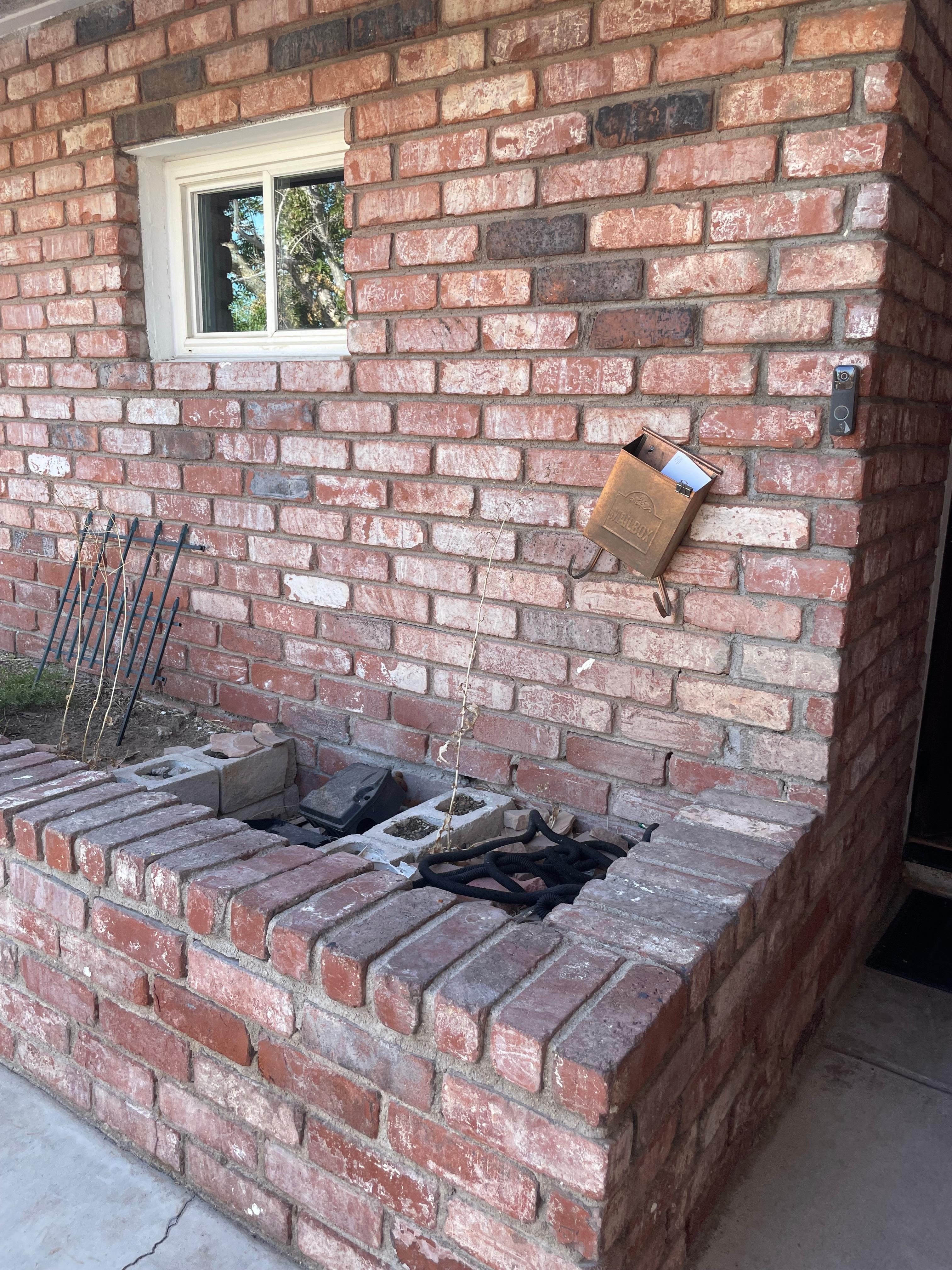 Entry to house very  uninviting. Front planter just had hose and junk thrown in it. Mailbox just hanging