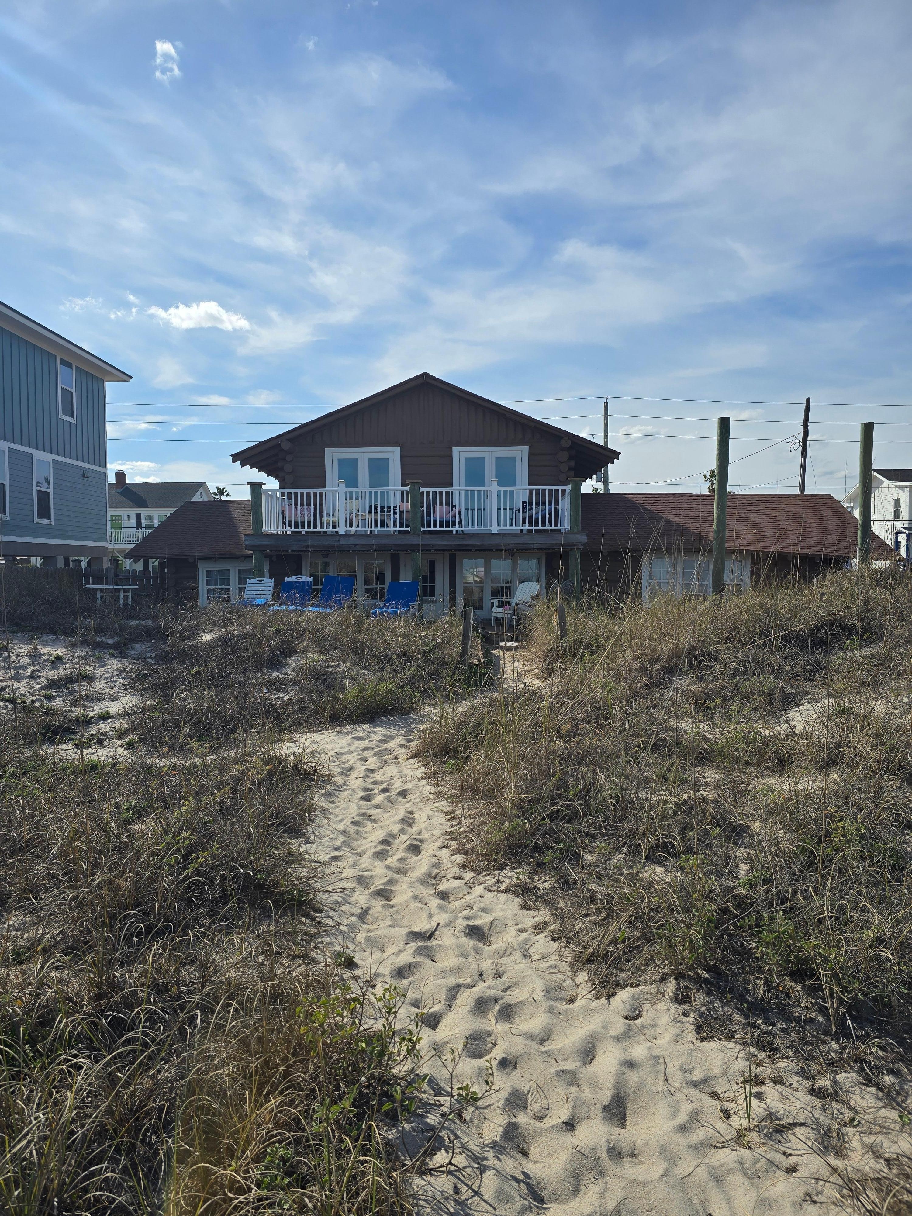 Short distance thru the dunes to quiet beach.