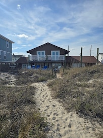 Short distance thru the dunes to quiet beach.