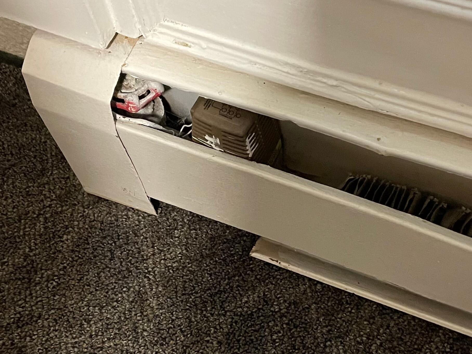Uncovered heating vents exposing wiring and sharp fixings