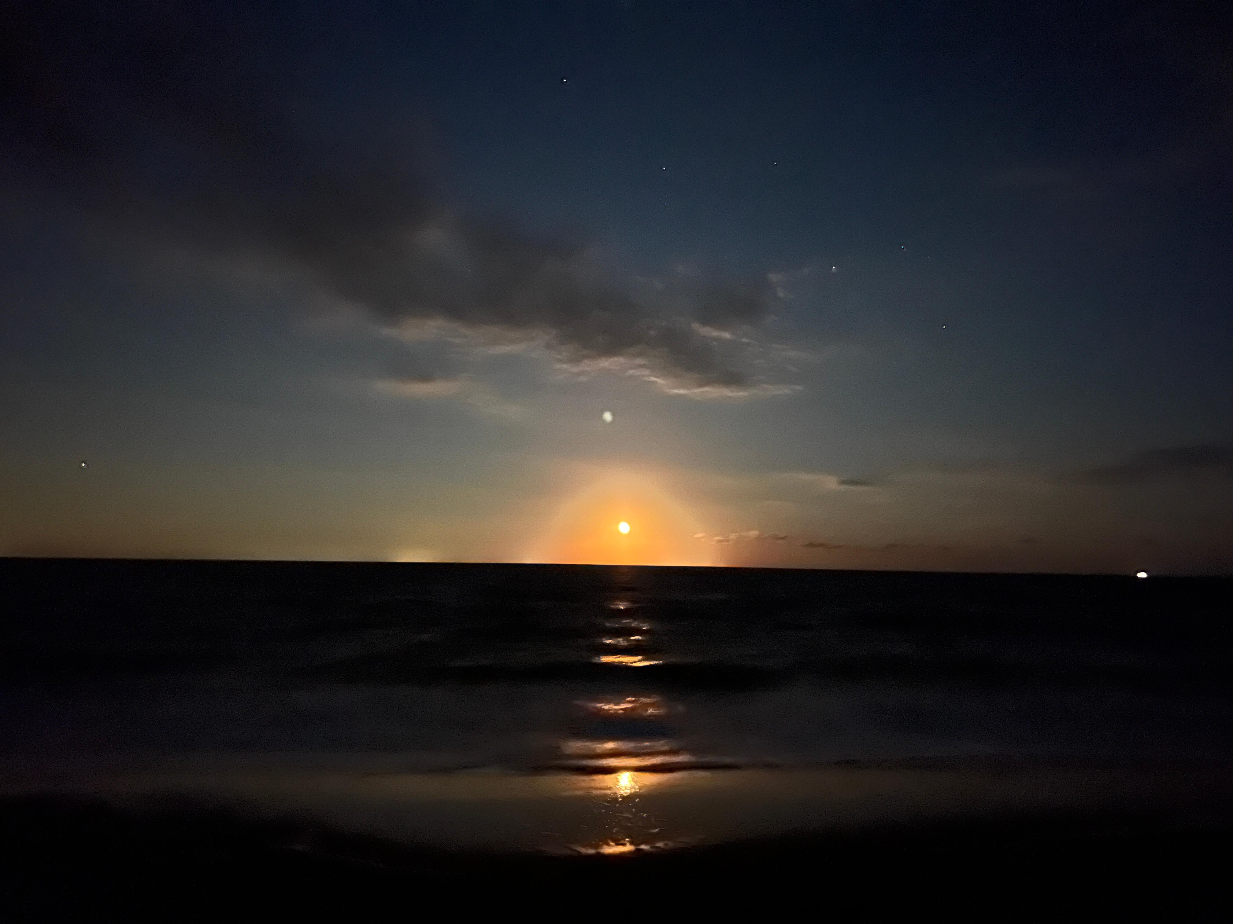 Beautiful moonrise over the Delaware Bay from the beach.