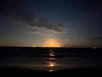 Beautiful moonrise over the Delaware Bay from the beach.