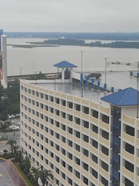 A view from the room with the parking garage in the foreground.